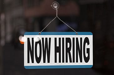 Career opportunities - Now Hiring Sign - Encompass Community Supports job listings